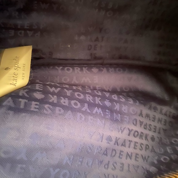 This genuine leather zip up purse is a dark navy blue. - Picture 6 of 7